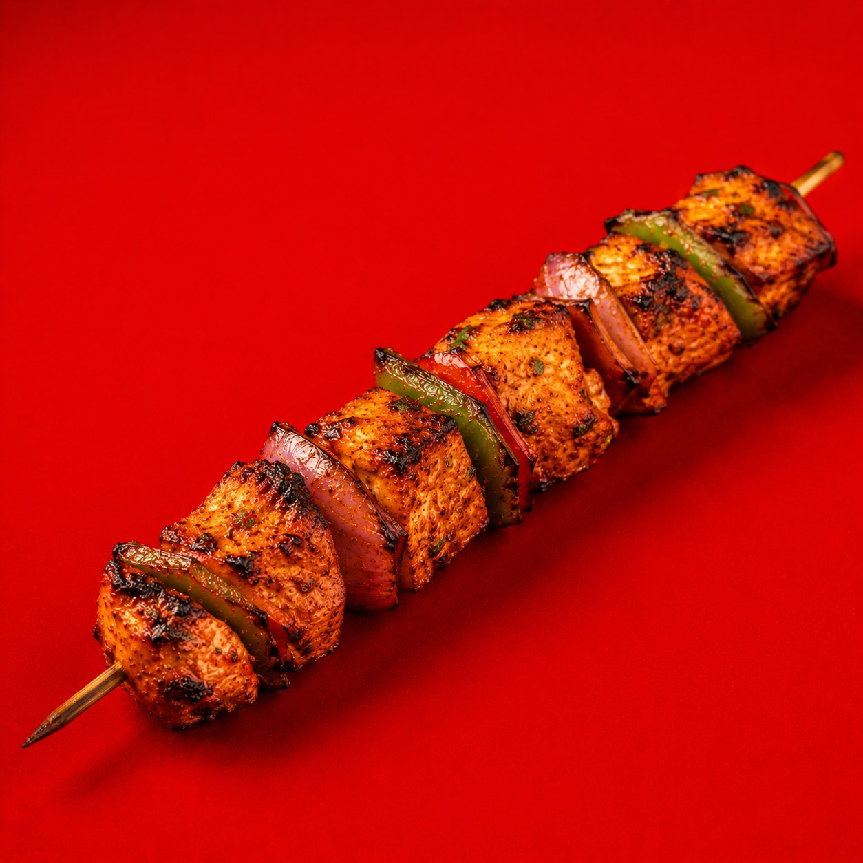 Grilled chicken tikka skewer, a signature dish at BK Restaurant